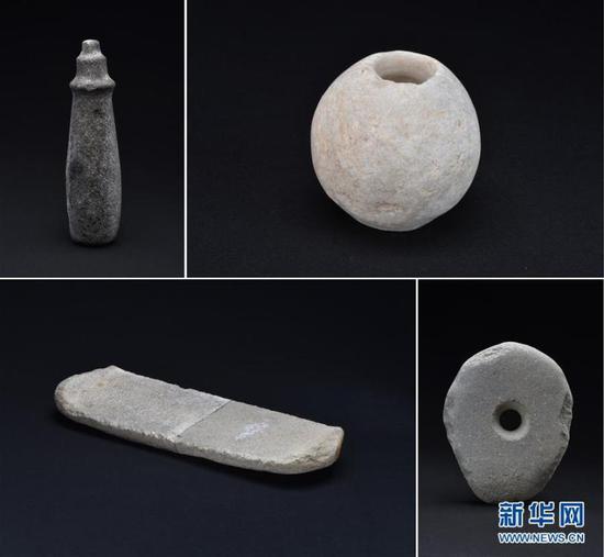 这是新疆尼勒克县吉仁台沟口青铜时代聚落遗址出土的石器（资料照片）