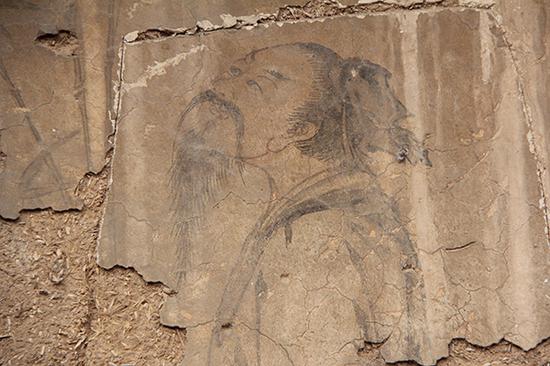 普照寺内一处被盗壁画,盗割者未能完整将壁画铲下。