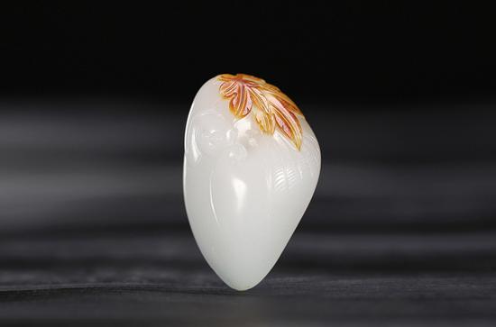 吴金星 和田玉籽料一夜封侯挂件

　　4.3×2.8×1.6cm 26.4g