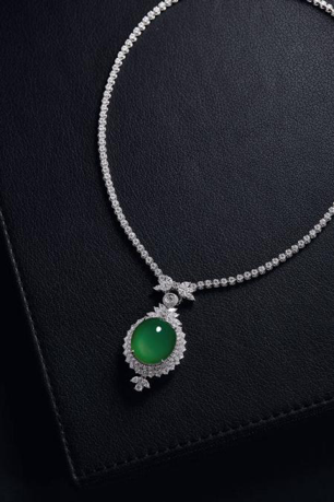 LOT 2067  JADEITE AND DIAMOND PENDANT NECKLACE 