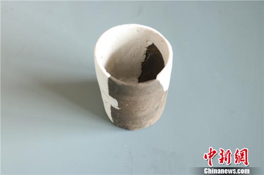 图为出土陶杯
