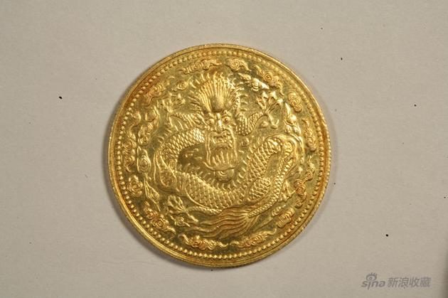 235b丁未大清金币一两,重量36、2克,直径38、9毫米。