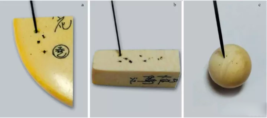 a。仿象牙样品表面；b。仿象牙样品的横截面；c。象牙样品表面