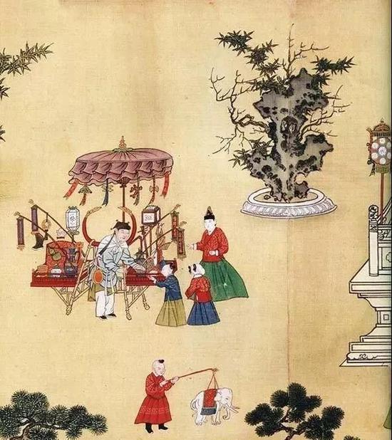 《宪宗元宵行乐图》（局部），卖花灯的货郎车，孩子正在买各式各样的彩灯。