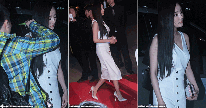 杨幂不怕冷穿无袖开叉裙 男助理为其梳头