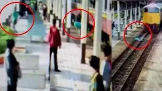 男子跳轨被火车碾后爬了起来