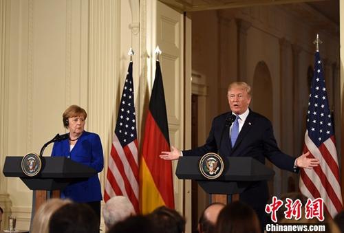 资料图：德国总理默克尔和美国总统特朗普。中新社记者 刁海洋 摄