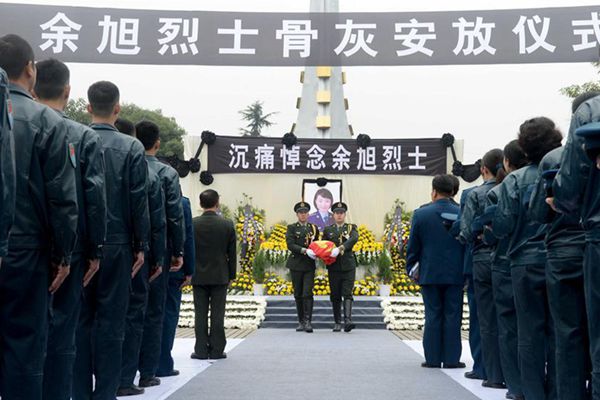 Ashes of fallen pilot placed in hometown cemetery