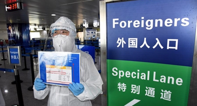 China guards against imported cases as overseas COVID-19 infections soar