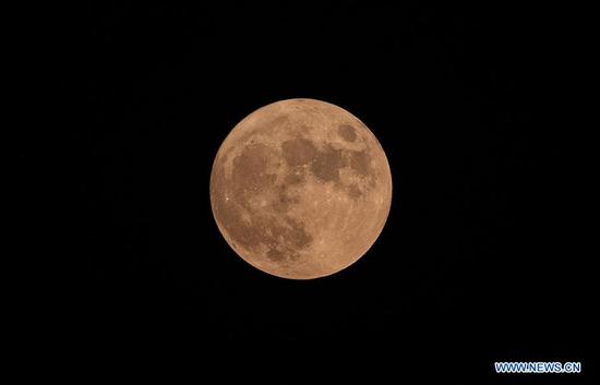  Photo taken on Aug. 3, 2020 shows the full moon in Changsha, central China's Hunan Province.  The full moon appeared on Monday, which is the fourteenth day on the sixth month of the Chinese lunar calendar.  (Xinhua/Qi Xiaoyi)