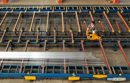 Aerial photo taken on Oct. 14, 2020 shows a staff member working on a production line of the Tangshan Jinhengtong Group in Lutai Economic Development Zone of Tangshan City, north China's Hebei Province. In recent years, local authorities of Lutai Economic Development Zone in Tangshan have pushed forward the upgrading and industrial agglomeration of local bicycle components production companies. With more than 40 companies achieving a yearly revenue of about 5 billion yuan (about 745 million U.S. dollars), the bicycle component products have made their presence in both domestic and overseas market. (Xinhua/Mu Yu)