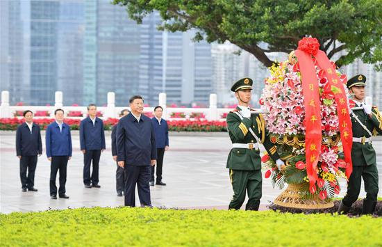 Chinese President Xi Jinping, also general secretary of the Communist Party of China Central Committee and chairman of the Central Military Commission, presents a flower basket to the statue of Comrade Deng Xiaoping at Lianhuashan Park in Shenzhen, south China's Guangdong Province, Oct. 14, 2020. Xi attended a grand gathering held to celebrate the 40th anniversary of the establishment of the Shenzhen Special Economic Zone and delivered an important speech on Wednesday. (Xinhua/Li Xiang)