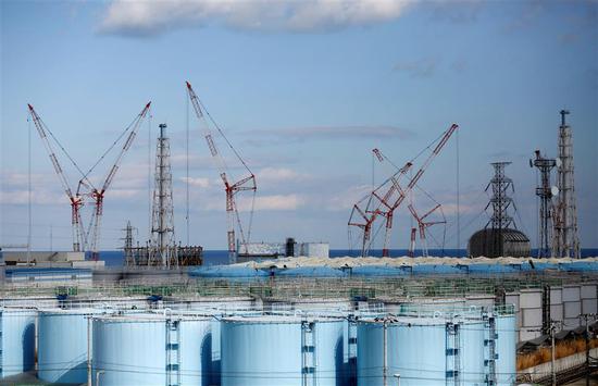 The reactor units No.1 to 4 are seen over storage tanks for radioactive water at Tokyo Electric Power Co’s tsunami-crippled Fukushima Daiichi nuclear power plant in Okuma town, Fukushima prefecture, Japan, on February 18, 2019.