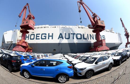 A ro-ro ship waits to load China-made cars for export at a berth of Port of Lianyungang in Lianyungang City, east China's Jiangsu Province, Sept. 7, 2020. (Photo by Geng Yuhe/Xinhua)