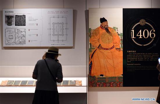 A visitor views exhibits during an exhibition entitled 
