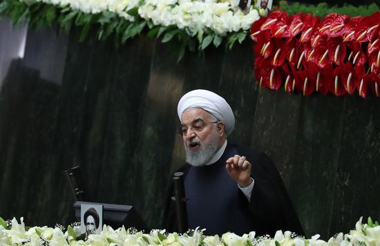 　　The file photo taken on May 27, 2020 shows Iranian President Hassan Rouhani addressing the opening session of Iran&#39;s new parliament in Tehran, Iran. (Photo by Ahmad Halabisaz/Xinhua)