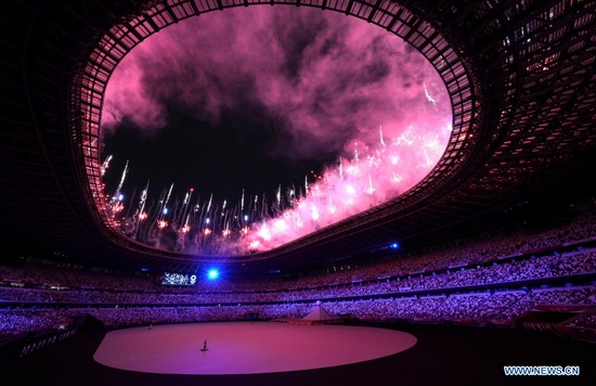 Fireworks explode over the Olympic Stadium during the opening ceremony of the Tokyo 2020 Olympic Games in Tokyo, Japan, July 23, 2021. (Xinhua/Fei Maohua) 