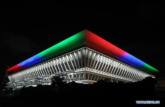  The Tokyo 2020 Paralympic Venue Tokyo Aquatics Centre is illuminated with the Paralympic symbol colours to mark one-year-to-go until the start of the postponed Tokyo 2020 Paralympic Games in Tokyo, Japan, Aug. 24, 2020. (Xinhua/Du Xiaoyi)