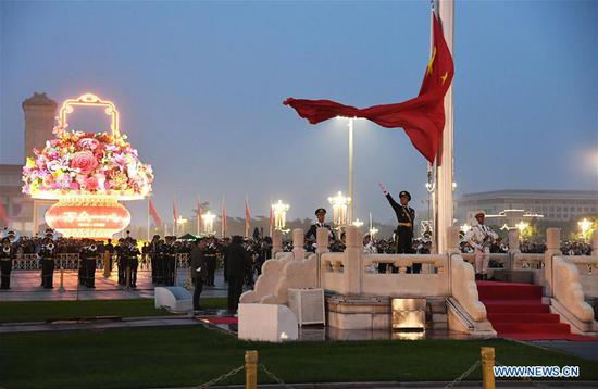 A flag-raising ceremony to celebrate the 71st anniversary of the founding of the People's Republic of China is held at the Tian'anmen Square in Beijing on Oct. 1, 2020. [Photo/Xinhua]