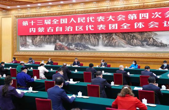 Chinese President Xi Jinping, also general secretary of the Communist Party of China Central Committee and chairman of the Central Military Commission, takes part in a deliberation with his fellow deputies from the delegation of Inner Mongolia Autonomous Region, at the fourth session of the 13th National People's Congress (NPC) in Beijing, capital of China, March 5, 2021. (Xinhua/Xie Huanchi)