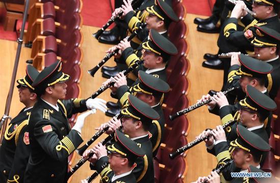 The military band of the Chinese People's Liberation Army performs during the opening meeting of the fourth session of the 13th National People's Congress (NPC) at the Great Hall of the People in Beijing, capital of China, March 5, 2021. (Xinhua/Jin Liangkuai)