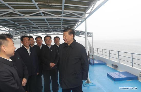 Chinese President Xi Jinping, also general secretary of the Communist Party of China Central Committee and chairman of the Central Military Commission, inspects the Danjiangkou Reservoir and listens to introductions to the construction, management and operation of the middle route of the South-to-North Water Diversion Project, and the ecological conservation of the water source region in Xichuan County, Nanyang, central China's Henan Province, May 13, 2021. (Xinhua/Wang Ye)
