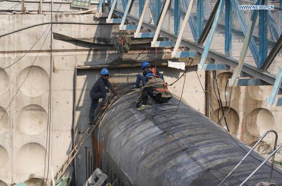Workers are busy at the construction site of the Baihetan hydropower station in southwest China, April 27, 2021. Construction of the Baihetan hydropower station in southwest China is proceeding smoothly. With a total of 16 homegrown million-kilowatt generating units, Baihetan hydropower station, located on the Jinsha River, the upper section of the Yangtze, straddling Yunnan and Sichuan provinces, is the second-largest in China after the Three Gorges Dam project in the central province of Hubei in terms of installed capacity. (Photo by Liang Zhiqiang/Xinhua)