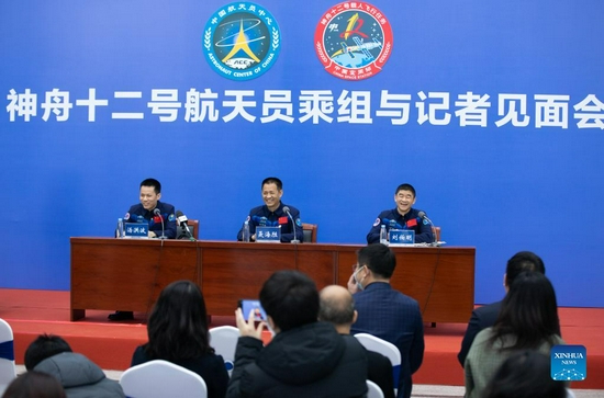  Chinese astronauts Tang Hongbo (L), Nie Haisheng (C) and Liu Boming attend a press conference held by the China Astronaut Research and Training Center in Beijing, capital of China, Dec. 7, 2021. Tang Hongbo, Nie Haisheng and Liu Boming, the three astronauts of the Shenzhou-12 spaceflight mission, on Tuesday met with the public and the press here for the first time after their return to Earth. (Xinhua/Jin Liwang)