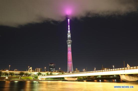 Tokyo Skytree is illuminated with a color symbolizing one of the Sustainable Development Goals (SDGs), as a part of a lighting pattern specially designed in the 17 colors of SDGs in Tokyo, Japan, Oct. 24, 2020. This special illumination of Skytree, designed to boost momentum toward achieving SDGs and to commemorate the 75th anniversary of the UN, will continue till Oct. 28, 2020. (Photo by Lyu Tianze/Xinhua) 