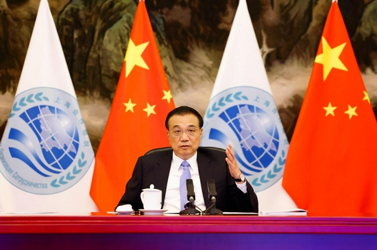 Chinese Premier Li Keqiang attends the 20th meeting of the Council of Heads of Government of Member States of the Shanghai Cooperation Organization (SCO) via video link at the Great Hall of the People in Beijing, capital of China, Nov. 25, 2021. (Xinhua/Huang Jingwen)