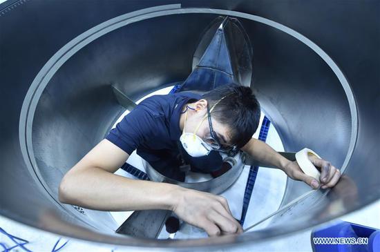 A member of staff works at Goodrich Aerostructures Service (China) Co., Ltd. in Tianjin Pilot Free Trade Zone (FTZ), north China's Tianjin, Aug. 20, 2020. With a number of high-end aviation maintenance enterprises gathering in the FTZ in Tianjin, the area has become an advanced aviation maintenance and testing base in the Asia-Pacific region. (Photo by Zhao Zishuo/Xinhua)