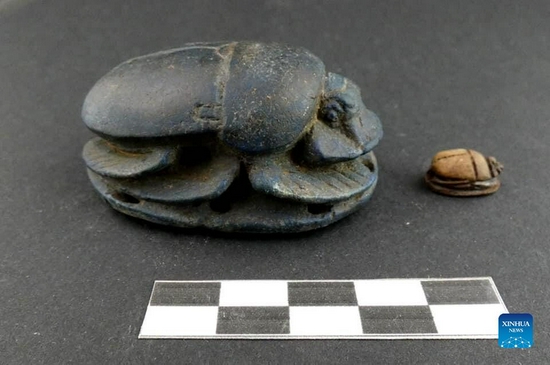 The undated photo shows scarabs unearthed from an ancient tomb in Minya Governorate, Egypt. A Spanish archaeological mission discovered two adjacent tombs in Upper Egypt's Minya Governorate dating back to the Saite Dynasty (664-525 BC), the Egyptian Ministry of Tourism and Antiquities announced on Sunday. (Egyptian Ministry of Tourism and Antiquities/Handout via Xinhua)