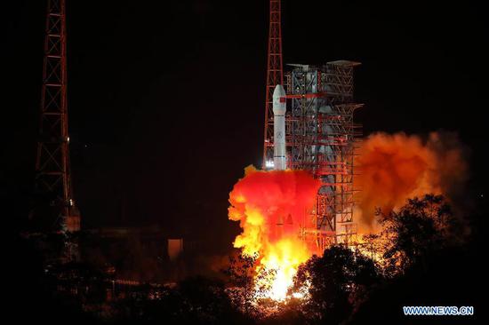China launches Chang'e-4 lunar probe in the Xichang Satellite Launch Center in southwest China's Sichuan Province, Dec. 8, 2018. The probe is expected to make the first-ever soft landing on the far side of the moon. A Long March-3B rocket, carrying the probe including a lander and a rover, blasted off from Xichang at 2:23 a.m., opening a new chapter in lunar exploration. The scientific tasks of the Chang'e-4 mission include low-frequency radio astronomical observation, surveying the terrain and landforms, detecting the mineral composition and shallow lunar surface structure, and measuring the neutron radiation and neutral atoms to study the environment on the far side of the moon, the China National Space Administration announced. China has promoted international cooperation in its lunar exploration program, with four scientific payloads in the Chang'e-4 mission developed by scientists from the Netherlands, Germany, Sweden and Saudi Arabia. (Xinhua/Jiang Hongjing)