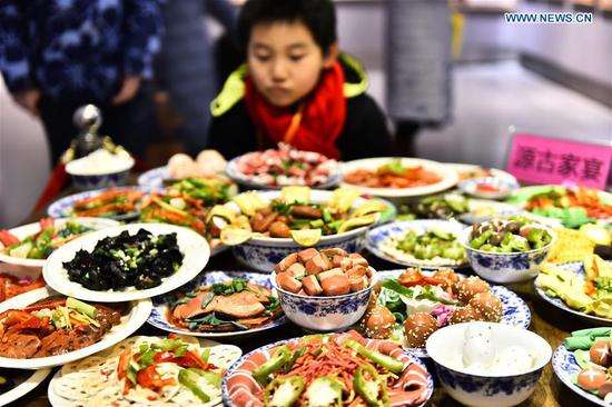Chinese new year food traditions Spring Festival dishes made of polymer clay on exhibition in east China