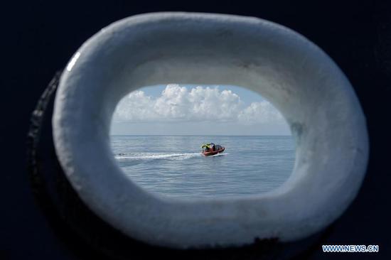  SpaceX support teams are deployed on a fast boat from the SpaceX recovery vessel GO Navigator ahead of a splashdown of the SpaceX Crew Dragon 