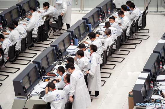 Technical personnel work at the Beijing Aerospace Control Center (BACC) in Beijing, capital of China, Aug. 2, 2020. China's Mars probe Tianwen-1 successfully carried out its first orbital correction at 7 a.m. (2300 GMT Saturday) after its 3,000N engine worked for 20 seconds, and continued to head for the Mars. (Xinhua/Cai Yang)
