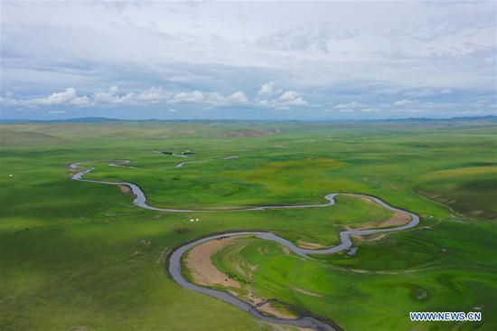 Aerial photo taken on Aug. 3, 2020 shows the scenery in Hulunbuir, north China's Inner Mongolia Autonomous Region. Local authorities in Hulunbuir have taken various measures, such as a more flexible working schedule and issuing tourist coupons, to boost local tourism market. (Xinhua/Xu Qin)