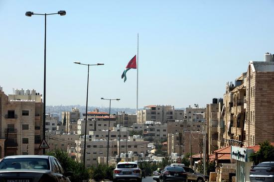 Jordanian national flag is seen at half-mast at Royal Hashemite Court, in Amman, Jordan, Aug. 5, 2020. Jordan's Royal Hashemite Court on Wednesday announced the national flag at its main entrance would be flown at half-mast for three days, mourning for the victims of the Beirut's explosions on Tuesday. (Photo by Mohammad Abu Ghosh/Xinhua)