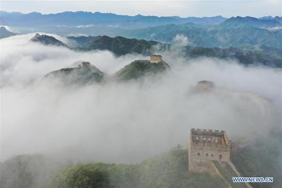  Aerial photo taken on Aug. 10, 2020 shows the Jinshanling Great Wall shrouded in morning mist in Luanping County of Chengde City, north China's Hebei Province. (Photo by Zhou Wanping/Xinhua)