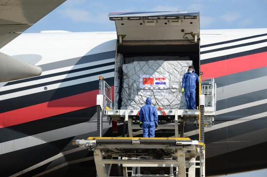 Airport staff unload medical supplies off a cargo aircraft from Shanghai of China in Zagreb, Croatia, April 12, 2020. (Xinhua/Gao Lei)