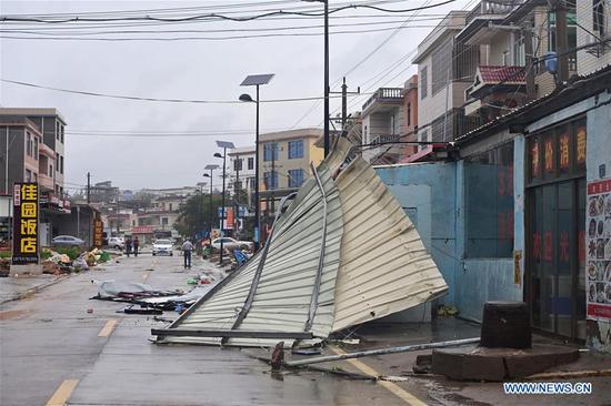 Advertisement boards are blown down by strong winds brought by Typhoon Mekkhala in Qianting Town of Zhangpu County, Zhangzhou, southeast China's Fujian Province, Aug. 11, 2020. Typhoon Mekkhala, the sixth this year, made landfall at around 7:30 a.m. Tuesday in Zhangpu County, east China's Fujian Province, bringing gales of up to 33 meters per second near its eye, according to local meteorological authorities. (Xinhua/Wei Peiquan)