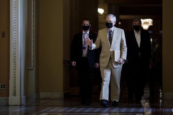 U.S. Senate Majority Leader Mitch McConnell (C) walks pass the Ohio Clock Corridor on Capitol Hill in Washington, D.C., the United States, Aug. 10, 2020. (Photo by Ting Shen/Xinhua)