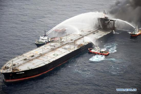Fireboats extinguish fire of the MT New Diamond oil tanker in the seas off Sri Lanka's eastern coast, on Sept. 8, 2020. The Sri Lanka Navy on Wednesday said a fire which had reignited onboard the MT New Diamond oil tanker on Monday has been brought under control and the distressed ship was being towed further away towards safe waters by a tug boat. (Sri Lanka Air Force Media/Handout via Xinhua)