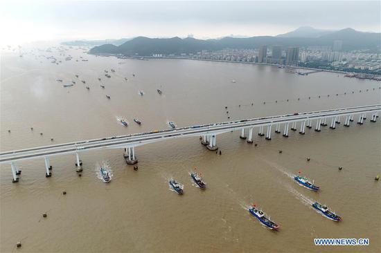 Aerial photo shows fishing boats sailing to the East China Sea in Zhoushan, east China's Zhejiang Province, Sept. 16, 2020. Fishing boats departed from ports in Zhejiang Province at noon on Wednesday, marking the end of the four-and-a-half month summer fishing ban in the East China Sea. (Photo by Yao Feng/Xinhua)