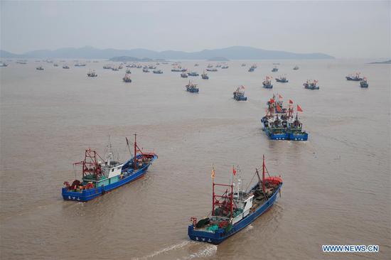 Fishing boats depart from the Shipu Port in Ningbo, east China's Zhejiang Province, Sept. 16, 2020. Fishing boats departed from ports in Zhejiang Province at noon on Wednesday, marking the end of the four-and-a-half month summer fishing ban in the East China Sea. (Photo by Zhang Peijian/Xinhua)