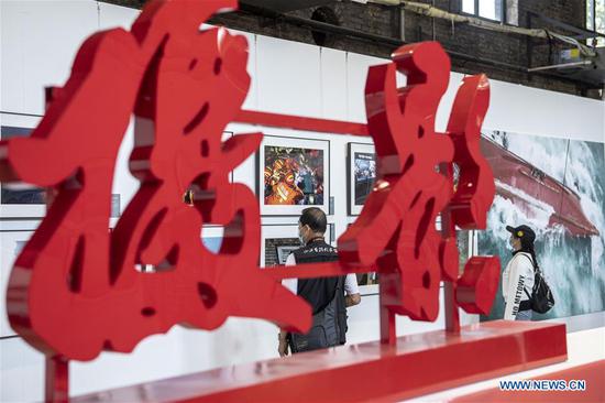 People visit the Pingyao International Photography Festival at Pingyao County in Jinzhong, north China's Shanxi Province, Sept. 19, 2020. The festival kicked off on Saturday, displaying more than 10,000 photography works by over 2,400 photographers from 15 countries and regions. (Xinhua/Yang Chenguang)