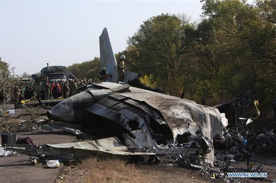 Photo taken on Sept. 26, 2020 shows the crash site of an An-26 military aircraft in Chuguev, Kharkiv region, Ukraine. The death toll from the Ukrainian military plane crash rose to 26, after one of the two people with serious condition died in hospital, the State Emergency Service of Ukraine said on Saturday. The An-26 military aircraft with 27 people on board crashed on Friday. The plane was performing a training flight and was landing at the airfield of a military base near the city of Chuguev, Kharkiv region. (Photo by Sergey Starostenko/Xinhua)