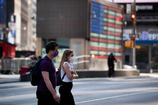 Pedestrians walk through Times Square in New York, the United States, Sept. 28, 2020. (Xinhua/Wang Ying)