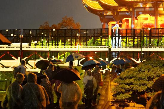 Tourists visit the Yellow Crane Tower during a night tour in Wuhan, central China's Hubei Province, Oct. 3, 2020. (Xinhua/Feng Guodong)