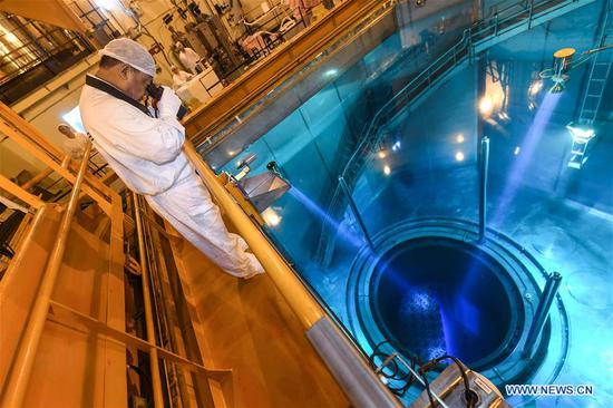 Qiao Sukai inspects the condition of fuel assemblies through a telescope at the Dayawan Nuclear Power Plant in Shenzhen, south China's Guangdong Province, April 12, 2019. Every 18 months, the Dayawan Nuclear Power Plant has to undergo a fuel assemblies replacement, which is one of the most important moments for the nuclear power plant. Dozens of engineers are divided into four shifts and operate the equipment day and night when the reactor is shut down. Their leader, Qiao Sukai, has been dealing with nuclear fuel since July 1993 when the nuclear fuel assembly of Dayawan Nuclear Power Plant arrived. The professional and technical maintenance team led by Qiao is responsible for the maintenance of nuclear fuel for more than half of the nuclear power units in the country. Qiao and his team have successfully operated fuel installing and uninstalling more than 170 times without making a single mistake. (Xinhua/Mao Siqian)